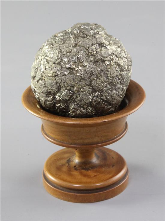 A Teklite nodule, diameter 2.5in., with wooden stand